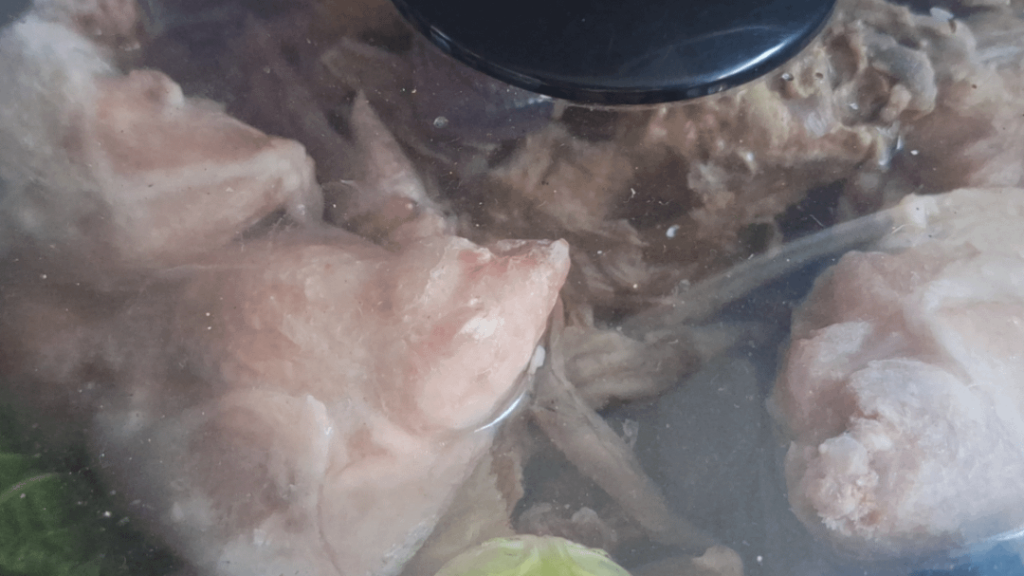 The very sexy sight of two chicken carcasses, one duck carcass, assorted wing tips and lots of veggie scraps all heading slowly towards broth.