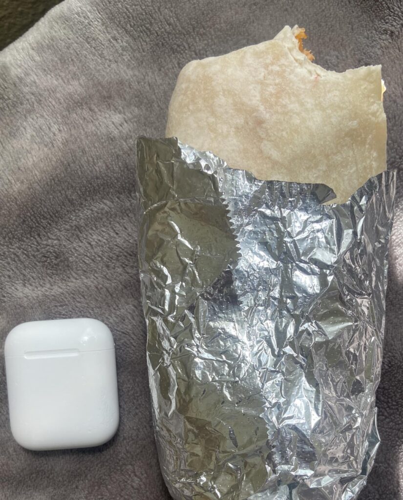 Burrito with chicken, rice and guacamole? The guacamole isn’t visible but it’s in there somewhere