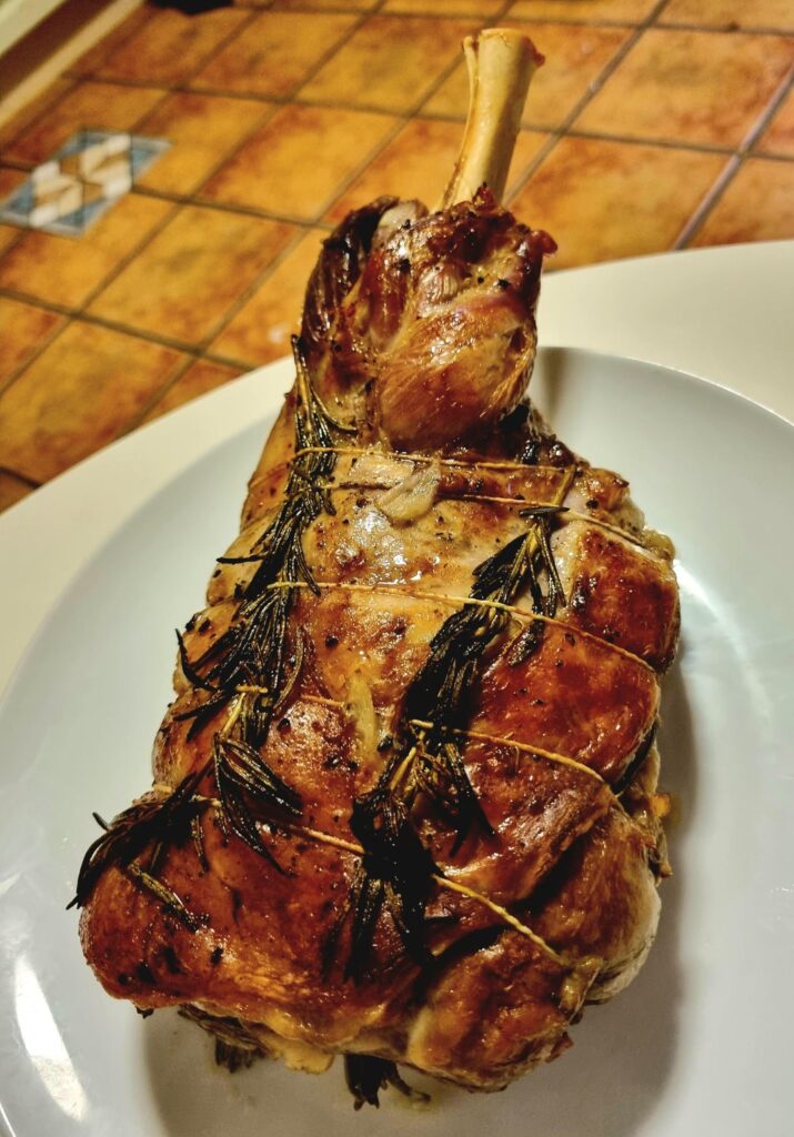 Lamb roast dinner, a bottle of red and a jam and cream gateau for dessert