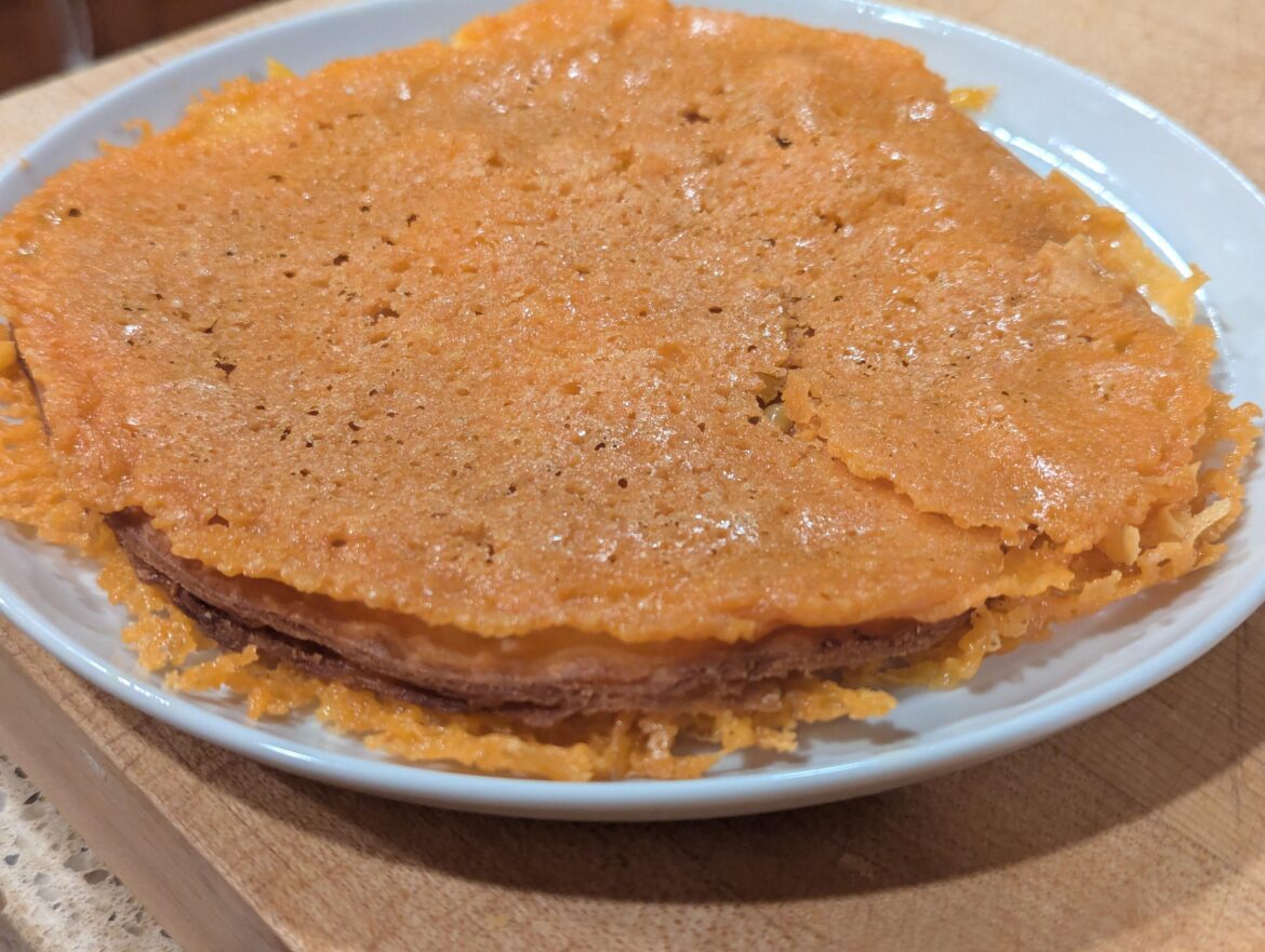 Inverted quesadilla. Cooked cheese until hard. Fried a tortilla in the cheese grease. Glue it all together with more cheese.