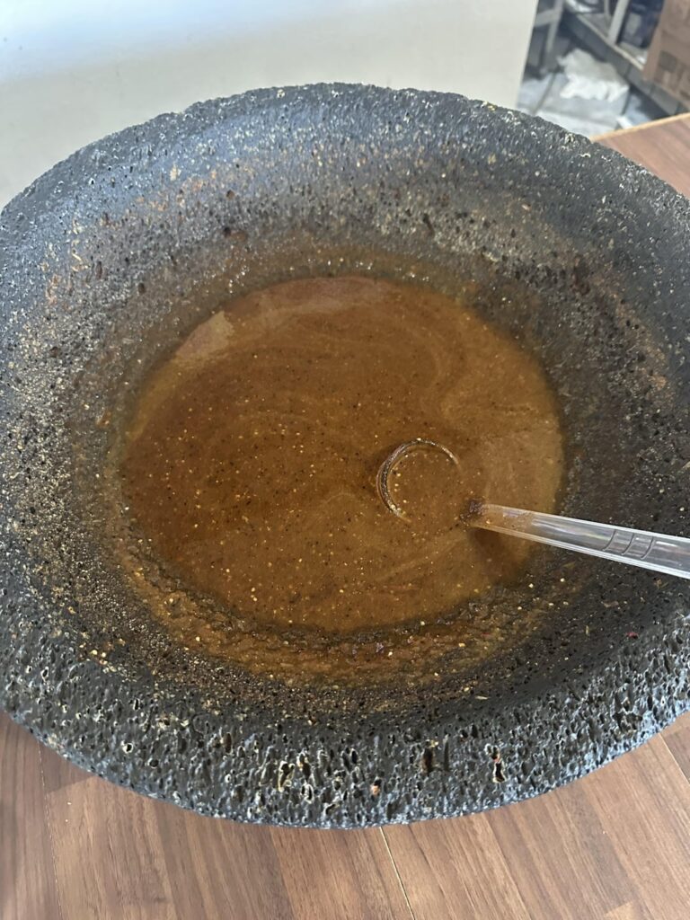 The size of this molcajete at this local Mexican food spot. Fresh salsa made on weekends.