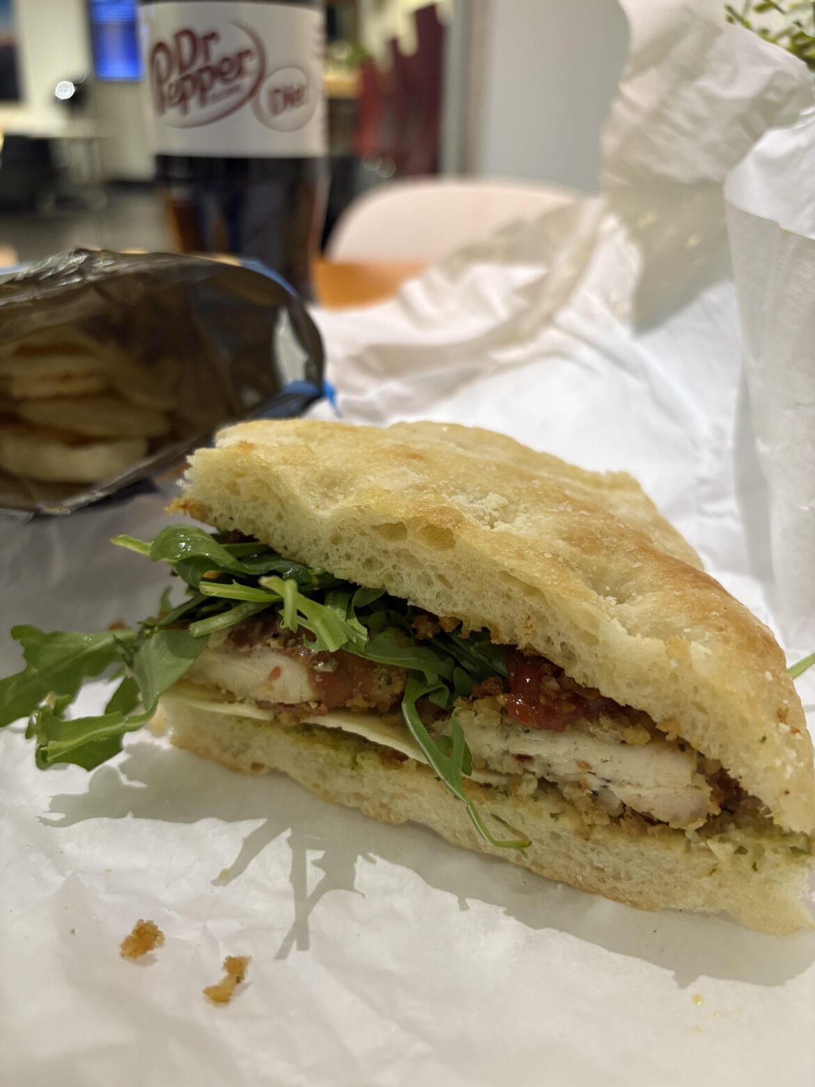 leftover chicken cutlet, provolone, pesto mayo, arugula, and roasted cherry tomatoes on homemade focaccia