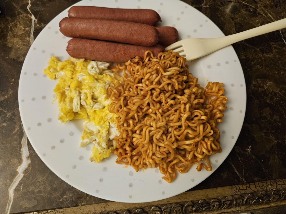 A very Filipino junk meal. Buldak w/ hotdogs and eggs
