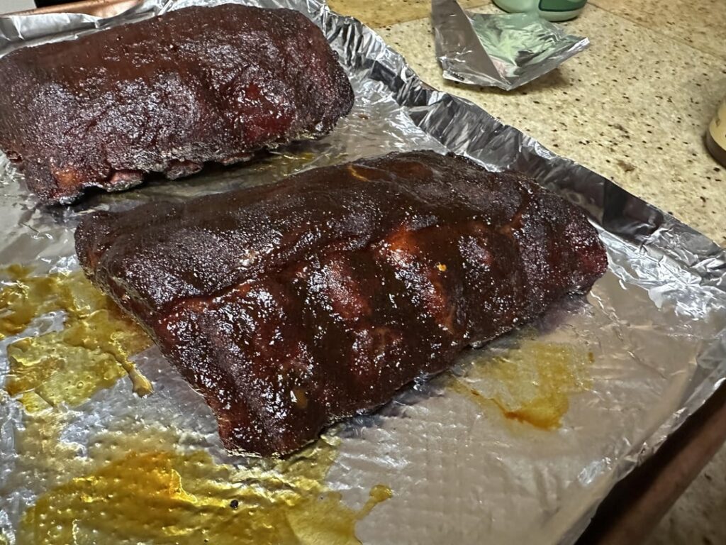 Gettin good with this thing! 321 Ribs. 2 sauces - Carolina Red + Sweet Heat