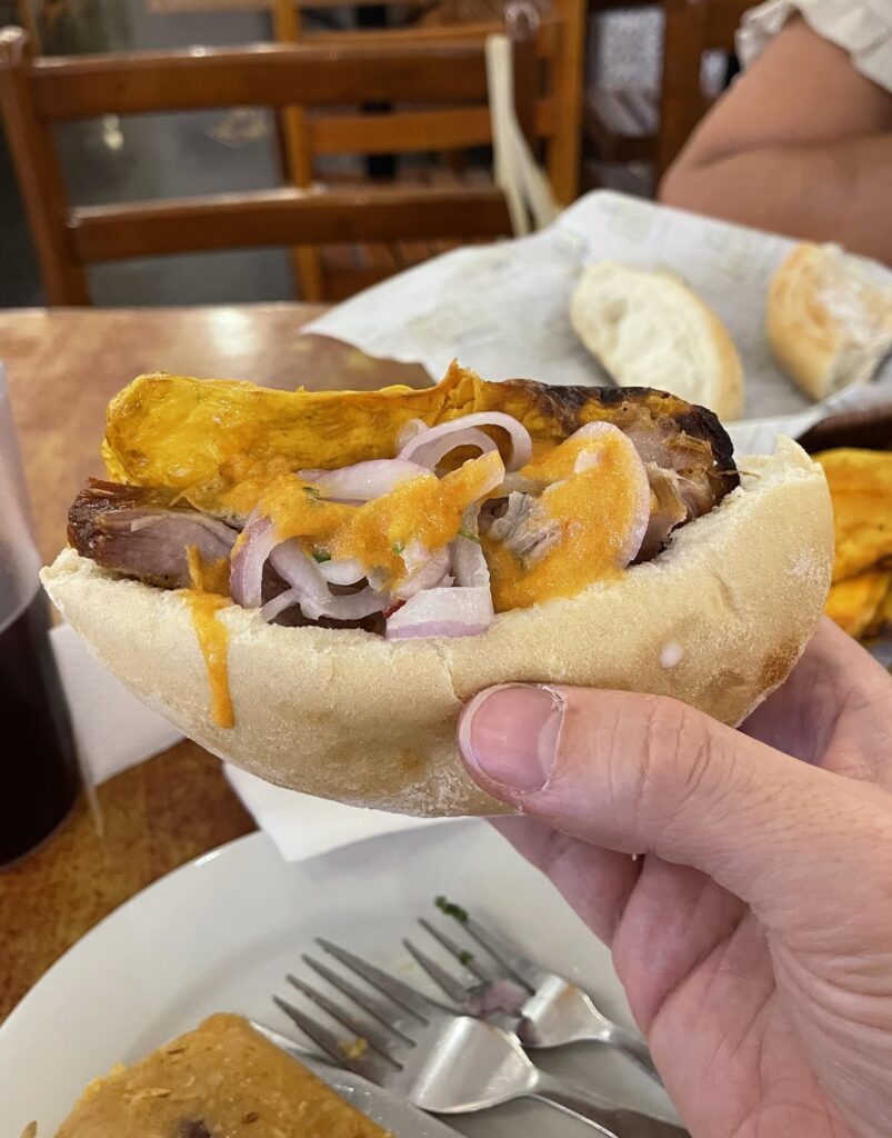 From El Chinito in Lima, Peru, one of the best sandwiches I’ve ever had: chicharron, fried sweet potato, garlic, and spicy aji sauce, stuffed into a roll
