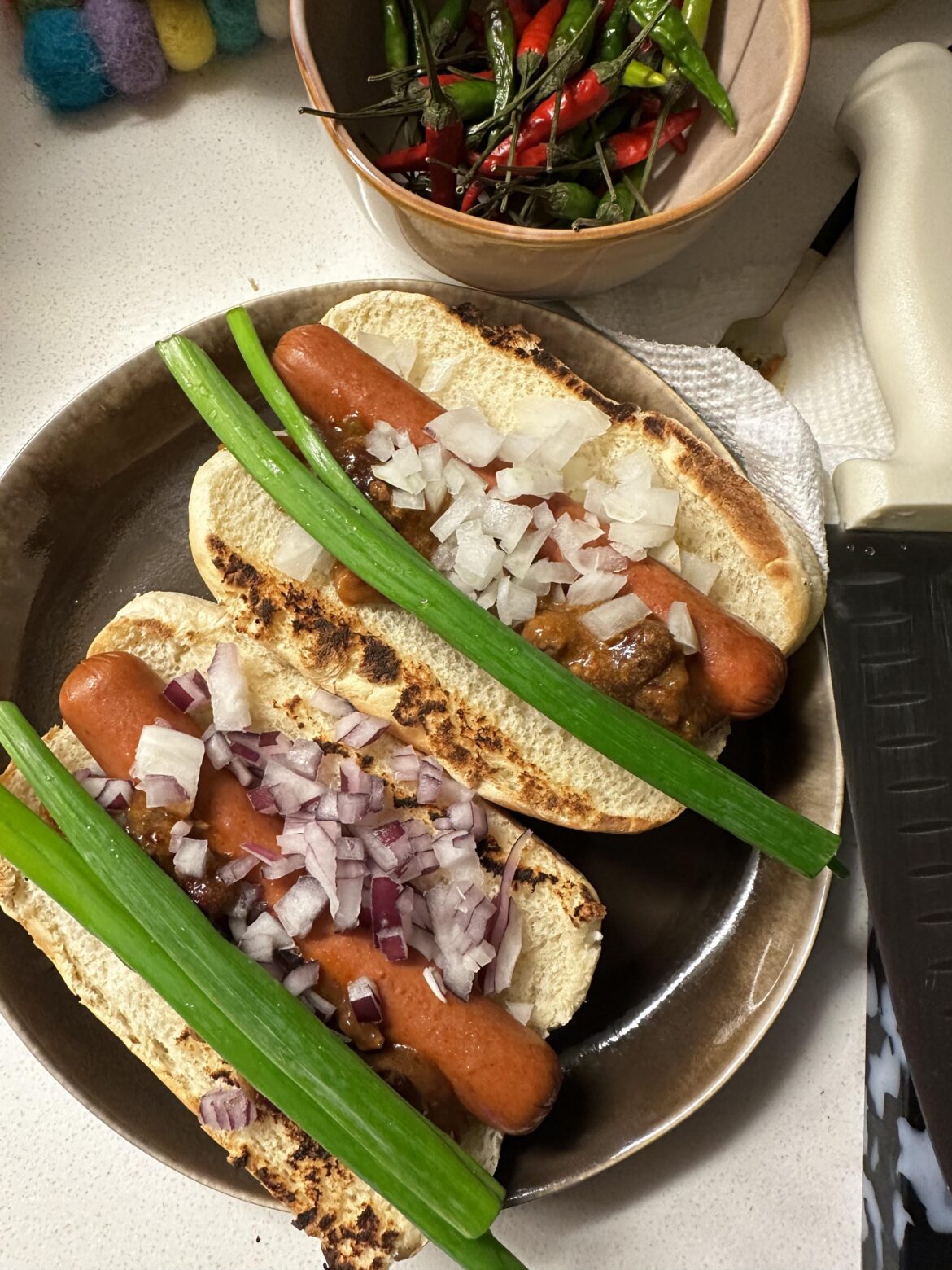my fiance is away on a sales conference so I am R&D'ing raw onion combos on hot dogs tonight