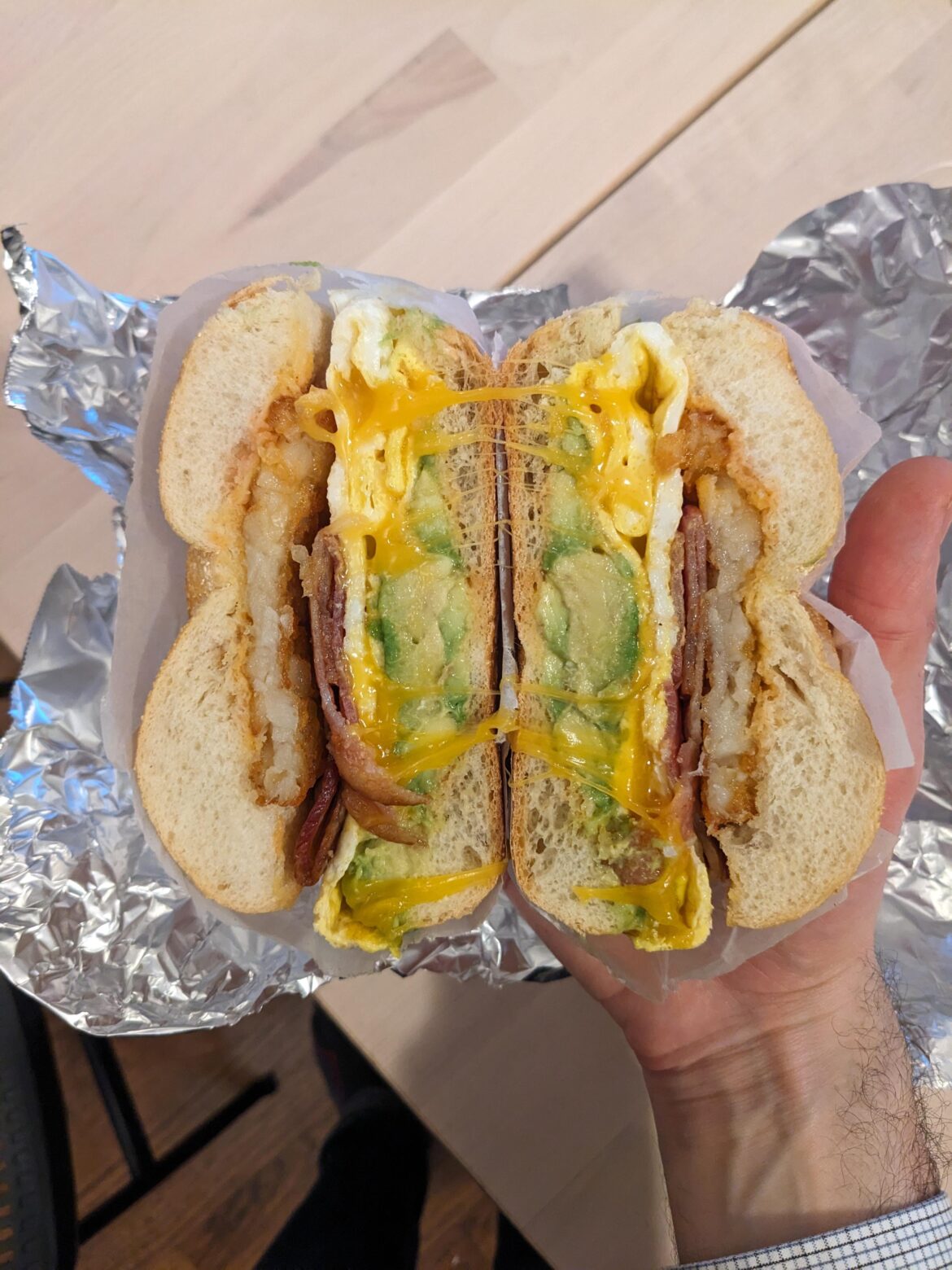 From the artists at my local deli: bacon, egg, avocado, cheese, and hashbrown on a roll