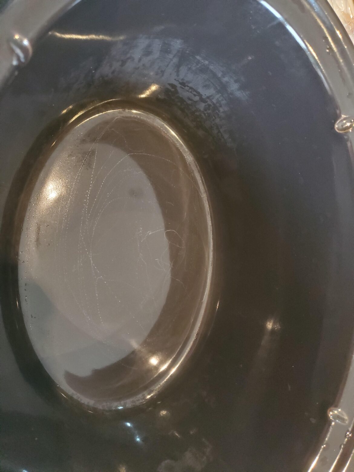 Lines on bottom of crock pot but the surface is smooth. Scratches, or safe to use?