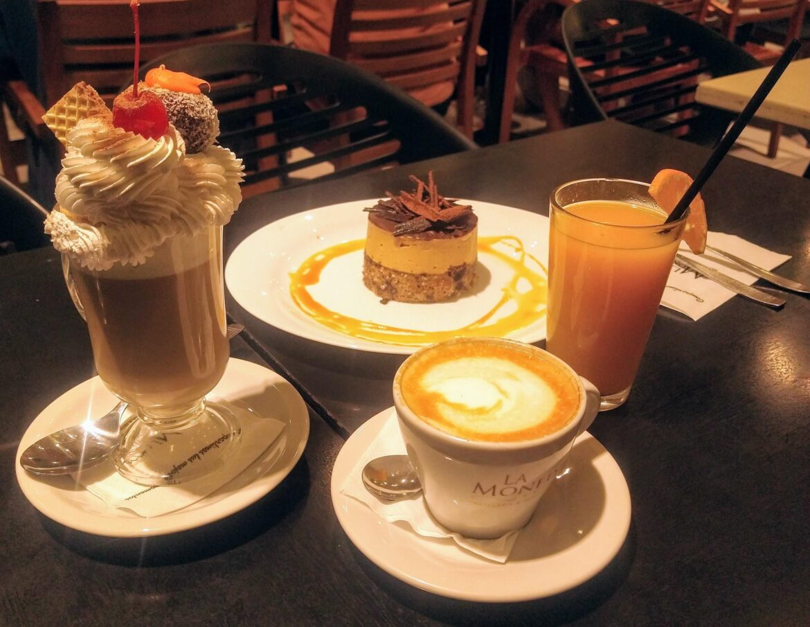 Capuccino with whipped cream on top and a latte! ~ Argentina.