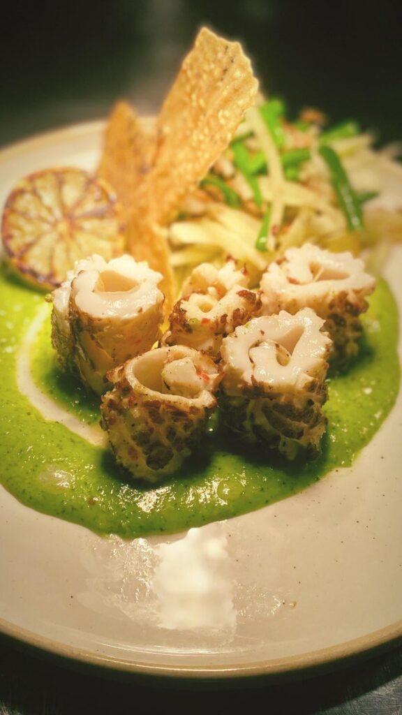 Squid with hafu sauce, sesame  tuile and som tom salad