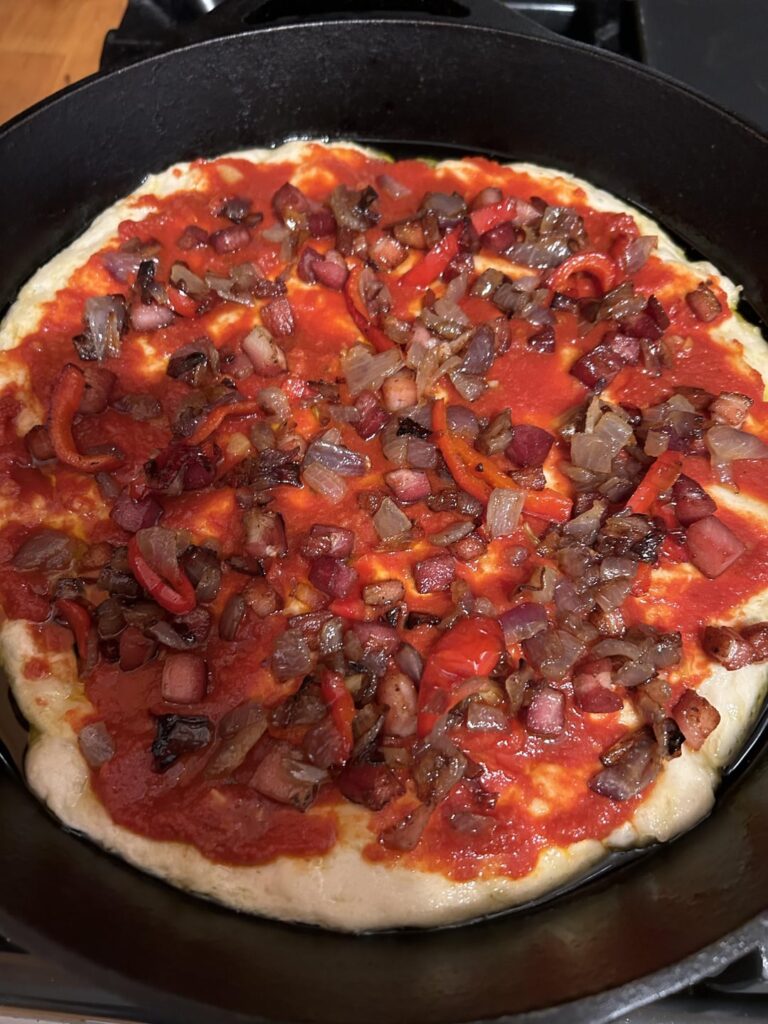 Yet another Kenji cast iron pizza.  This one with lightly caramelized pancetta, red onion, and (a little) red pepper.