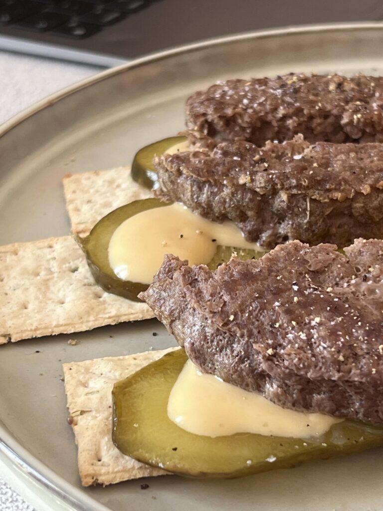I cooked some burger patties and then discovered my bread was mouldy so I used crackers instead.