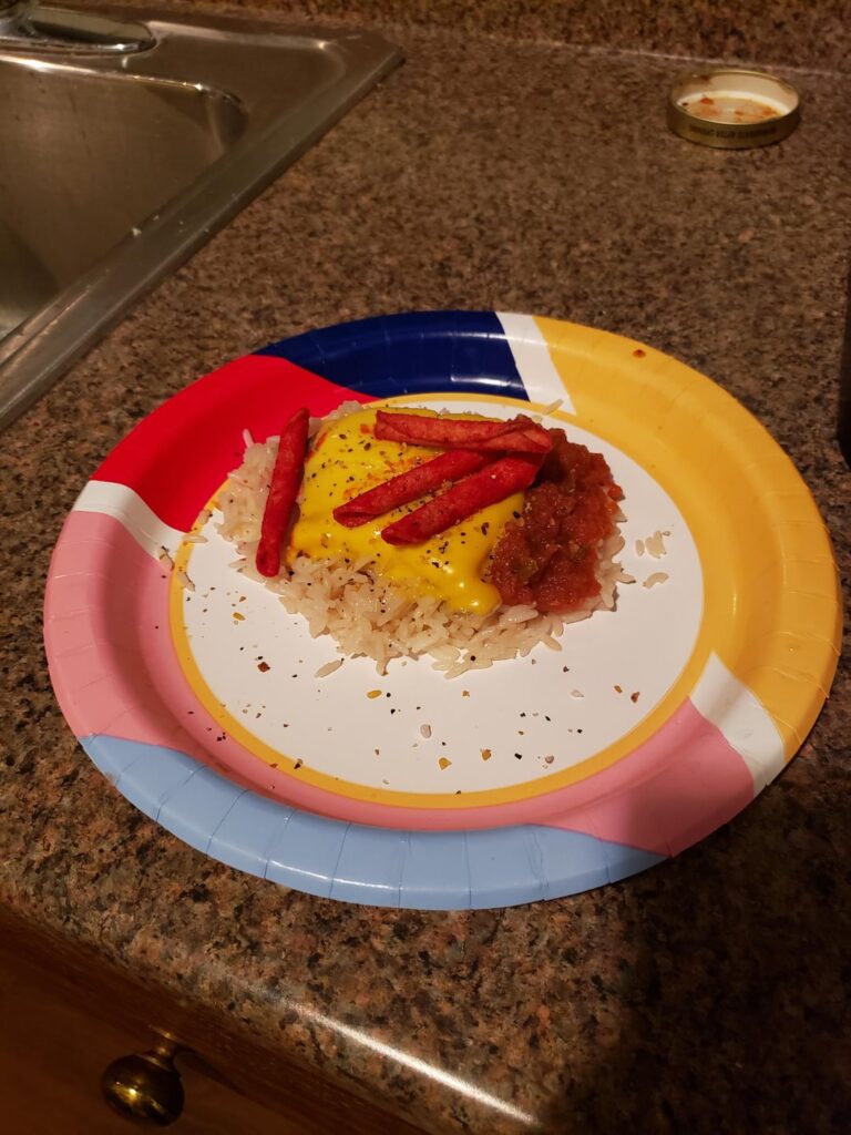 I take care of a guy with ALS. U have to blend his food. This is what he wanted. I plate the food and show him cause we think it's funny. Microwave rice canned trout a cheese slice, takis and some salsa