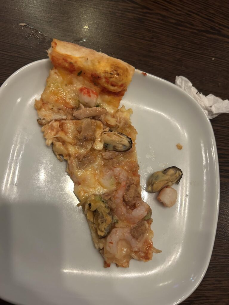How much for this swedish thin tuna/ shrimp/mussel pizza? (Yes, it was good. And please imagine that the second one is not half-eaten lol)