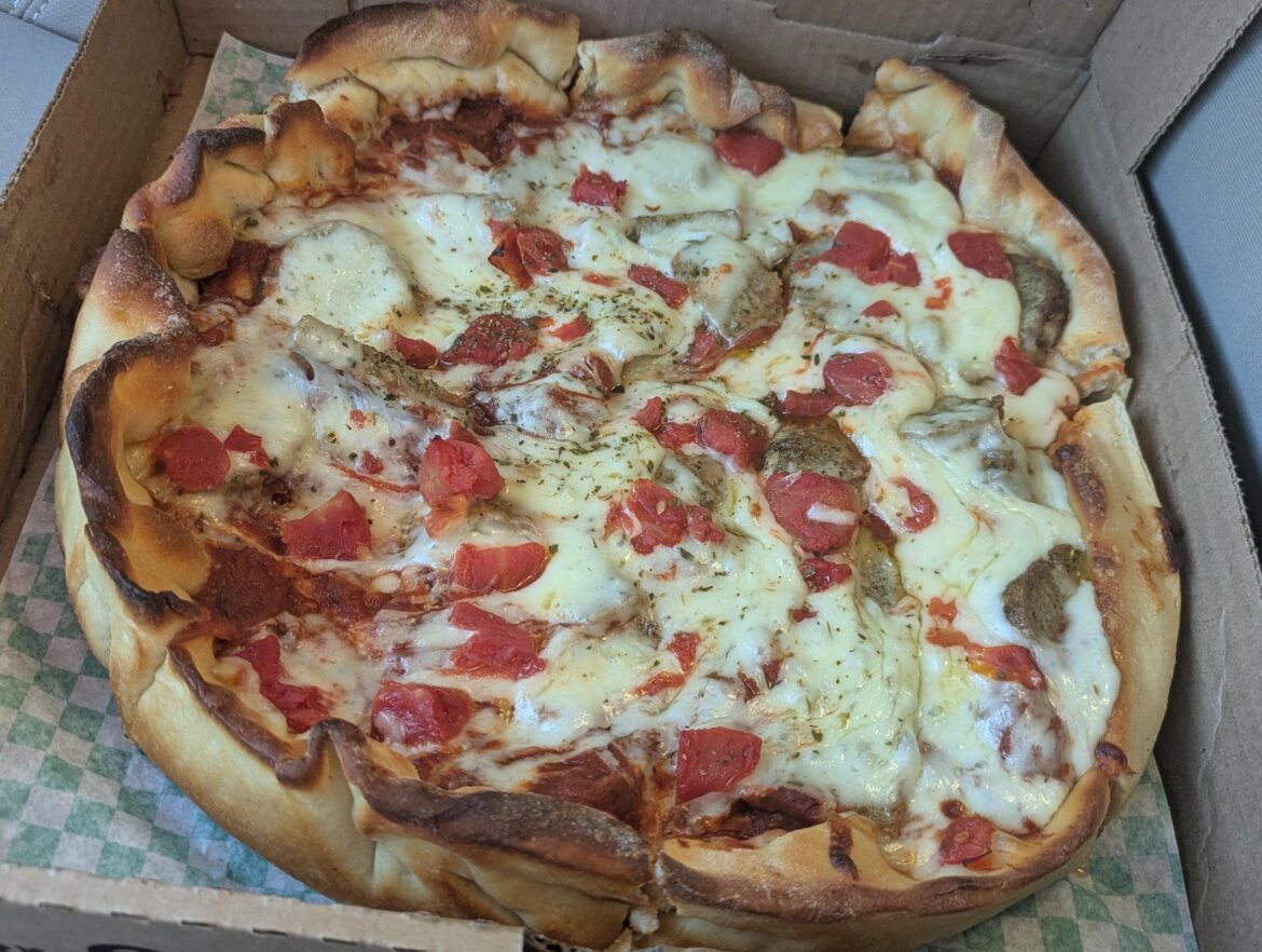 Chicago style pan pizza from a local chain. That is not mozzarella. THEY USE WISCONSIN WHITE CHEDDAR.