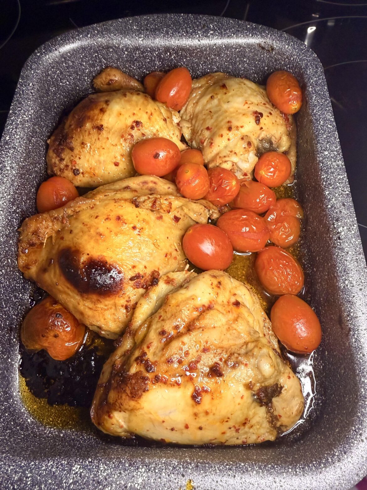 Roasted chicken cutlets and tomatoes