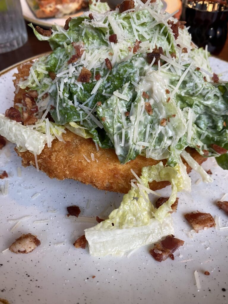 How many calories in this Ceasar salad on top of a (large) chicken schnitzel?