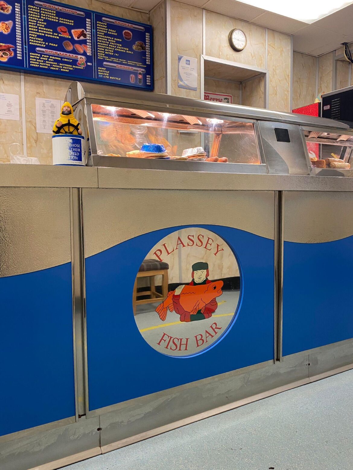 Hallowed ground. I love a classic chip shop interior. A very impressive patina on the deep sea fishermen’s charity box and the waiting stools visible in the mirror (I’m sat on one) are a welcoming touch.