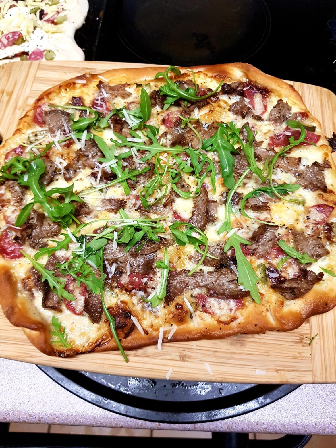 NY Deli Pizza. A White/ Mustard and Horseradish Base... Salami, Pastrami, Gherkin, Caramelized Onion and Love 💛 Finished with Rocket and Parm