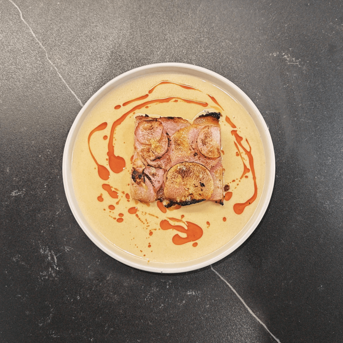 radish gratin, burnt radish leaves beurre blanc, citrus&chili oil, finger lime