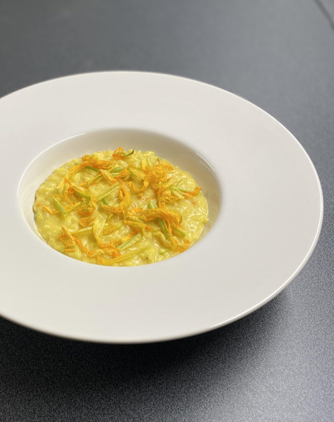 Saffron risotto with zucchini flowers and parmigiano