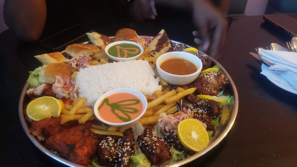 I had this platter for lunch: fries with wings, rice and chicken.