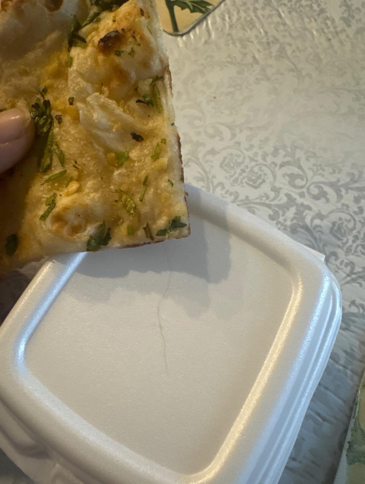 Can you sue the uber eats or the restaurant for delivering the food with hair on the food.