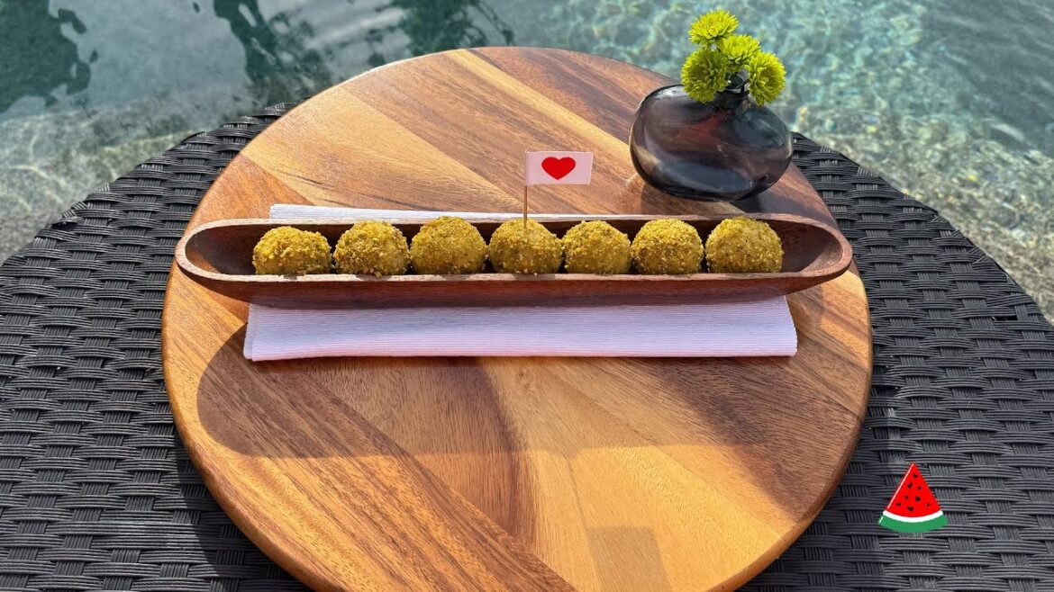 Pistachio balls dessert filled with thick cream