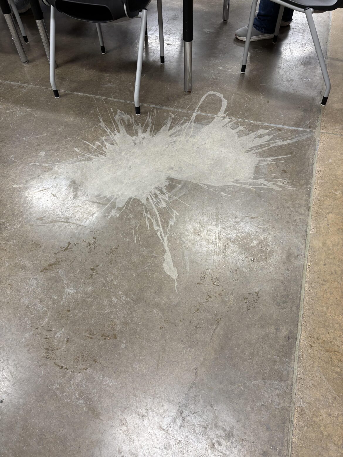 Spilled bottle of Tapatio hot sauce removed the finish from the floor.