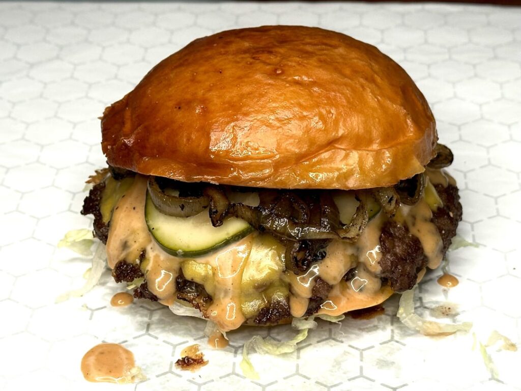 Weekly burger with charred onions Weekly burger with charred onions