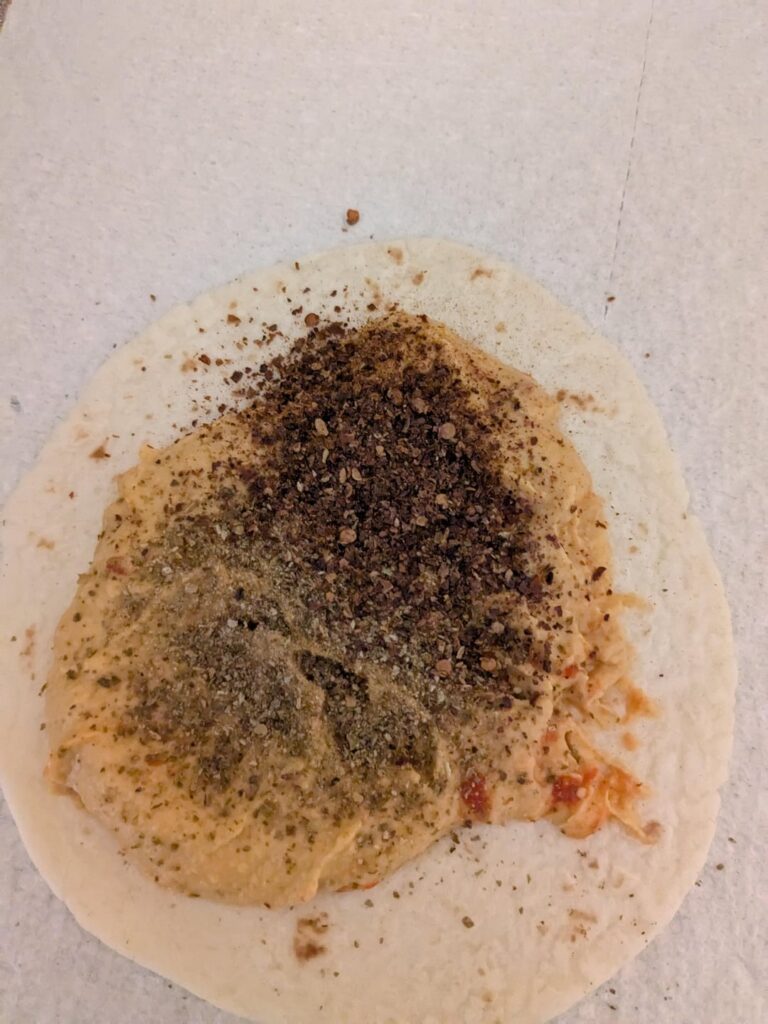 Smoked ghost and green ghost flakes on some hummus and in a hummus taco. I'd say about 40 grinds of the grinder. 20 each something like that.
