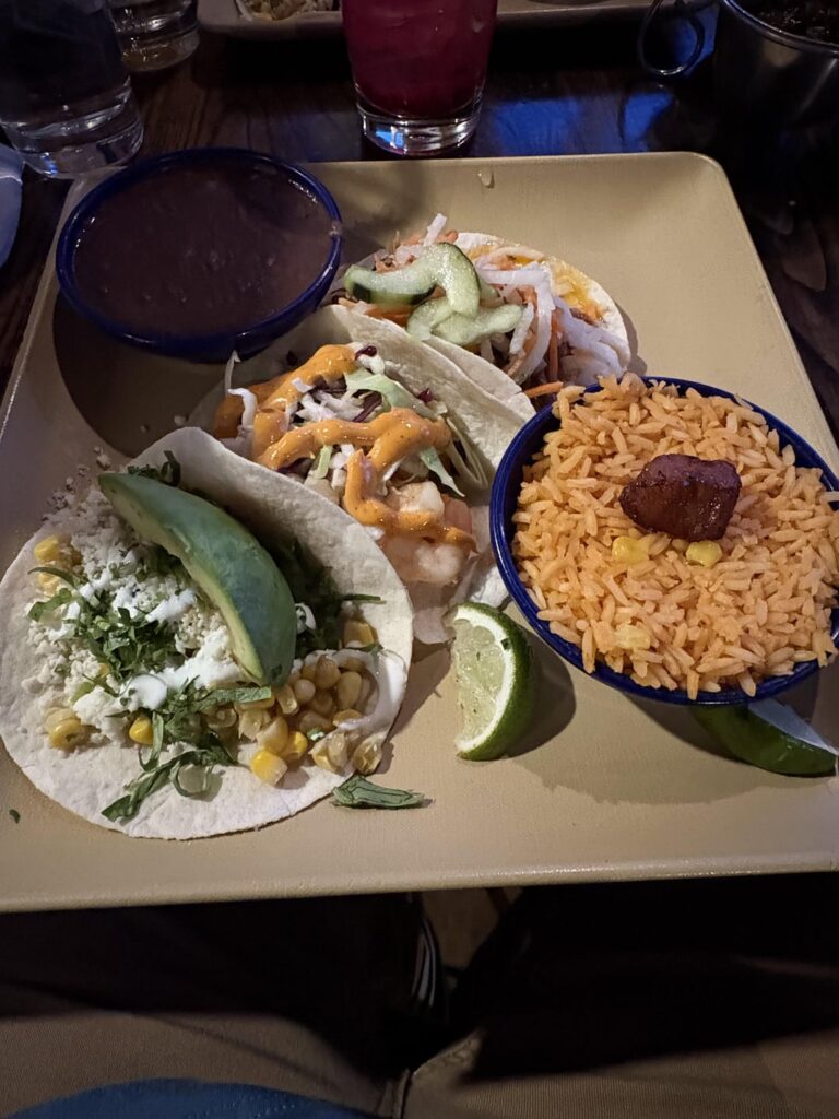 How many calories for three tacos and rice and beans? The ingredients in each taco are listed on the menu pictures.