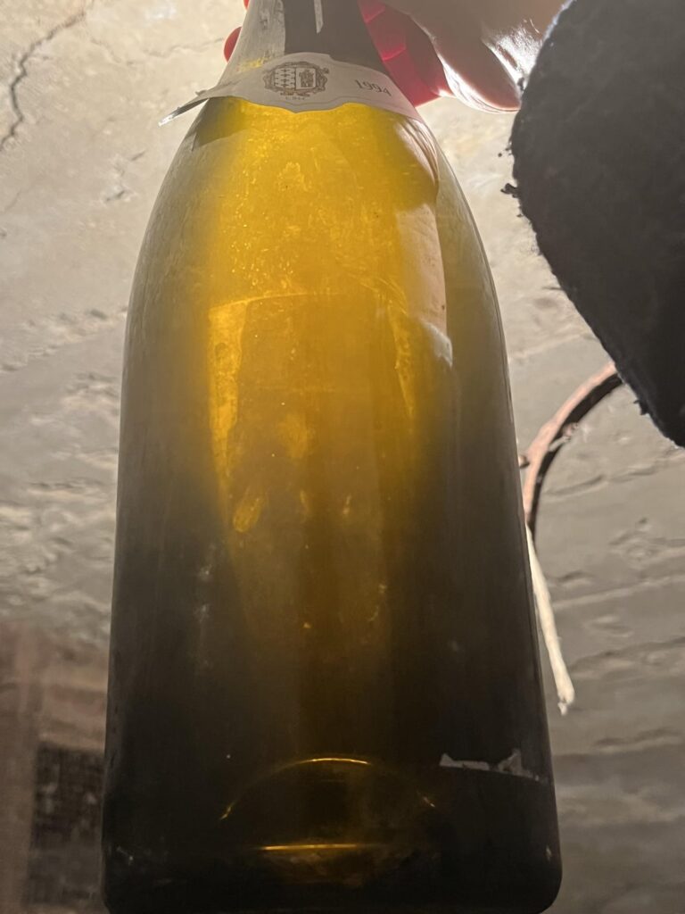 Can the wine gods identify this bottle? Found this in the back of the cellar. No clue what it is.