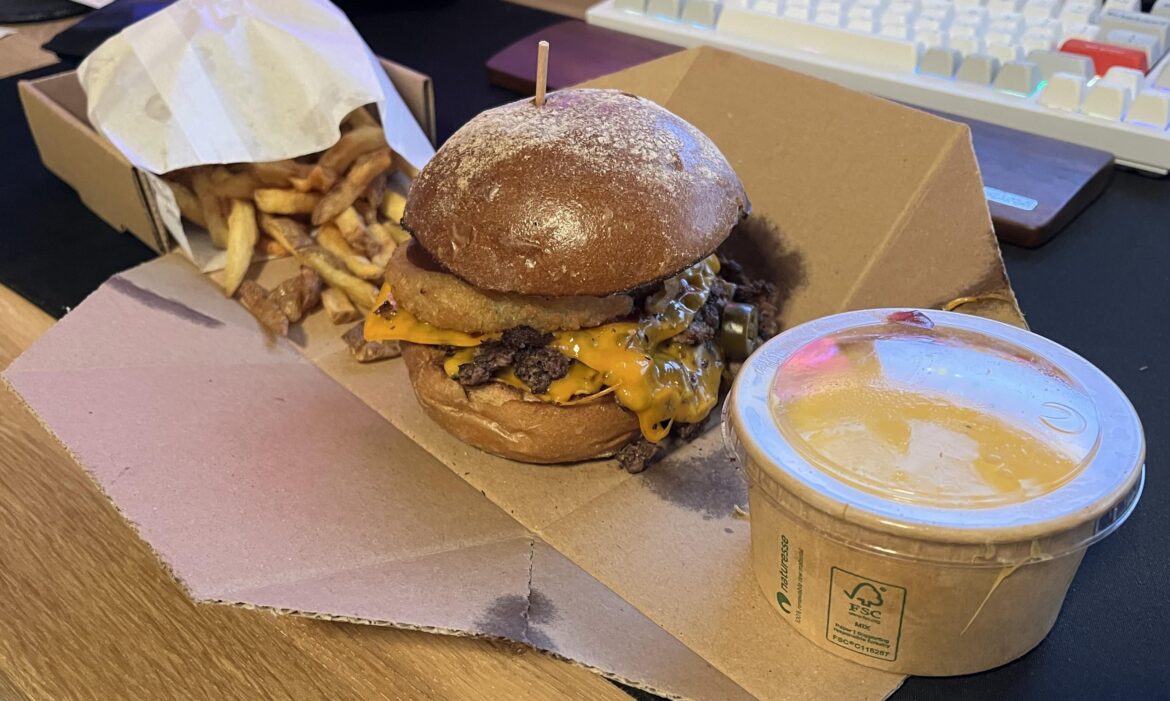 Barbecue burger with fries and cheese sauce