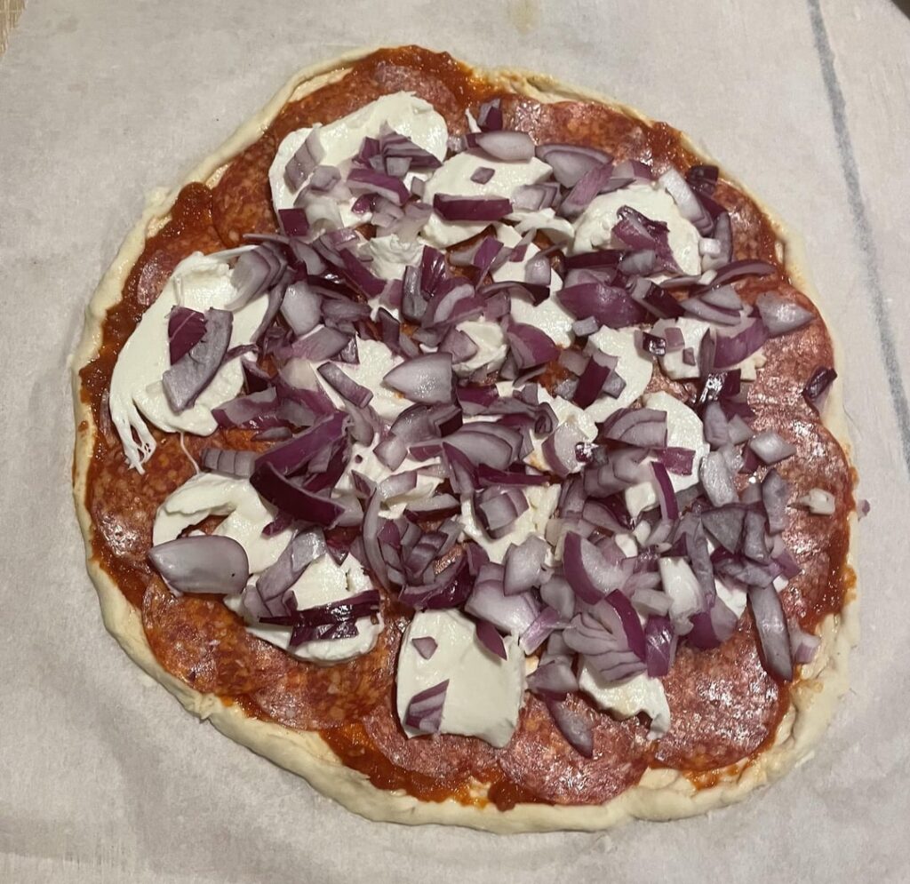 Pizza I made with a little bit of red onion