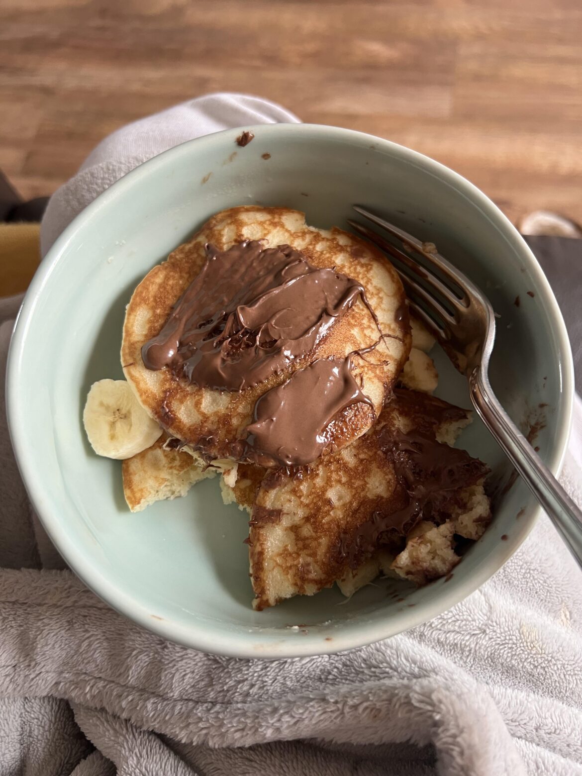 Half eaten banana and Nutella pancakes. 518 cals