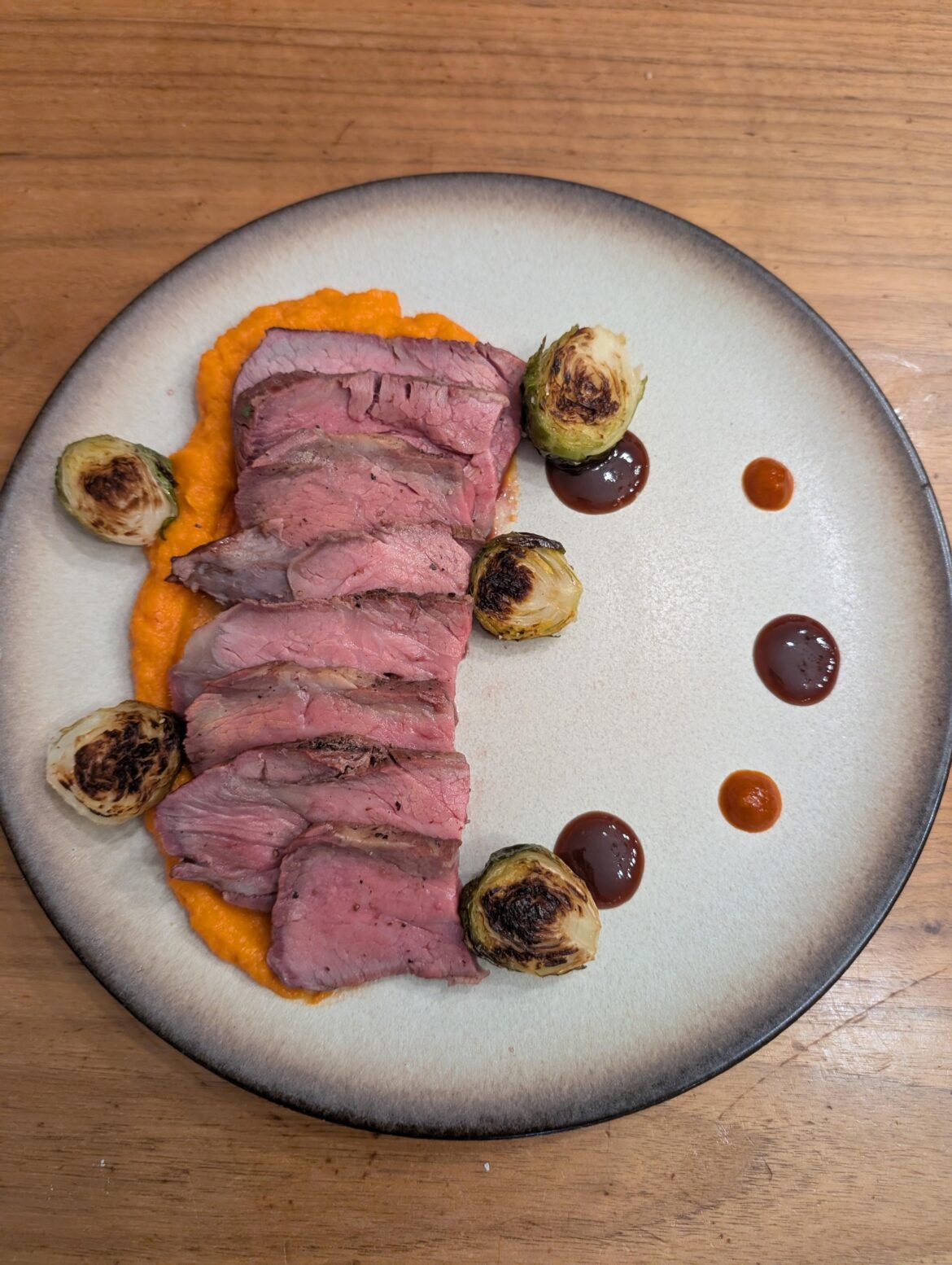 Smoked tritip, carrot puree, brussel sprouts with BBQ and Sriracha.