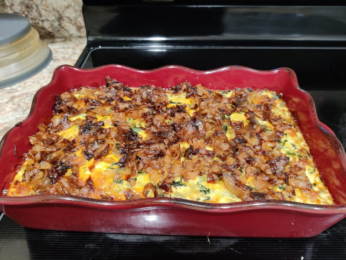 Spinach and cheese frittata topped with caramelized onions