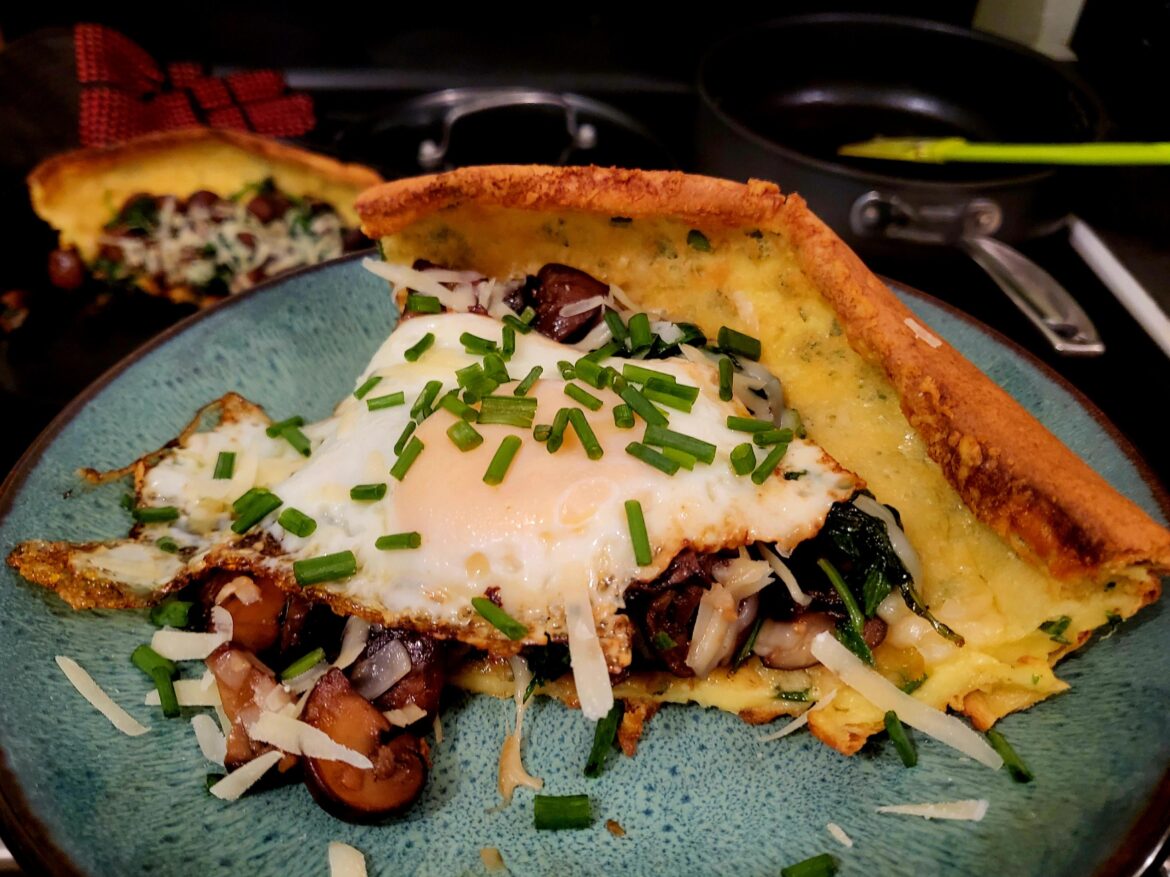 Parmesan-Herb Dutch Baby with Garlic-Butter Mushrooms.....With an Egg On It