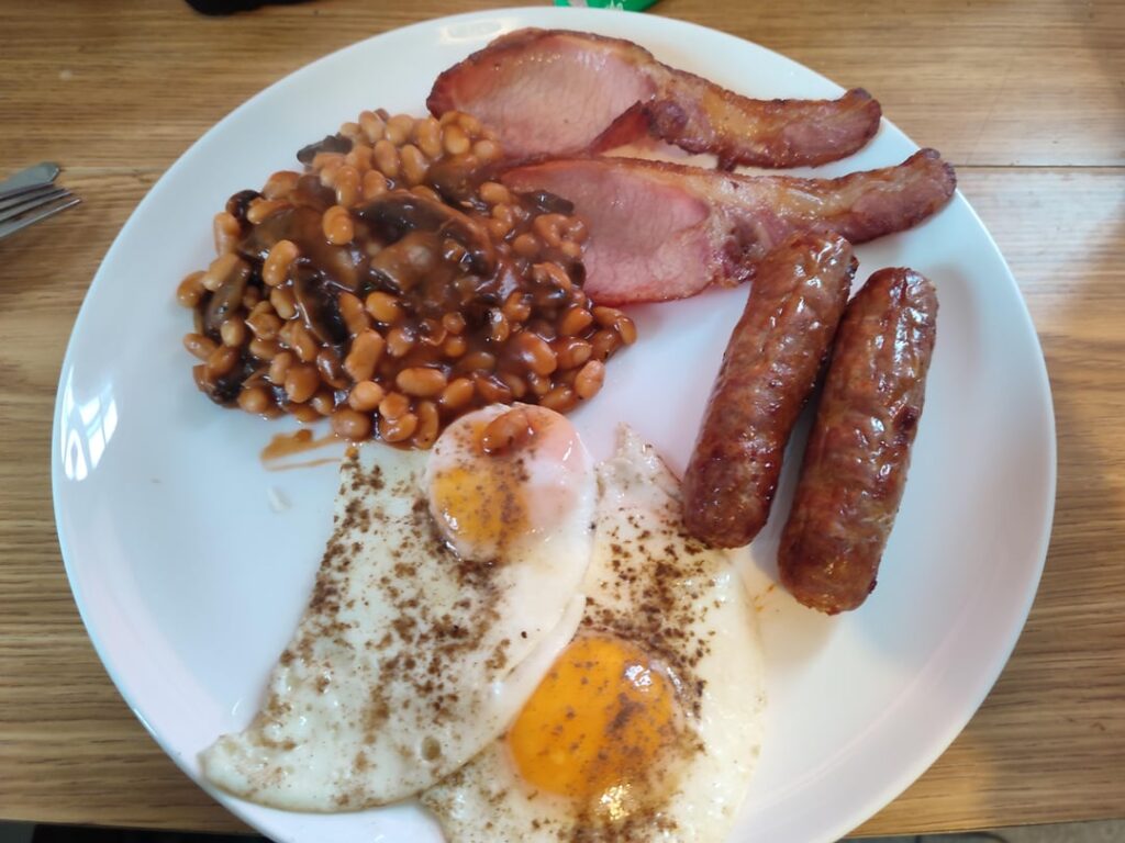 Air fryer sausage and bacon, beans mixed with fried mushrooms, eggs fried in lard 🤤