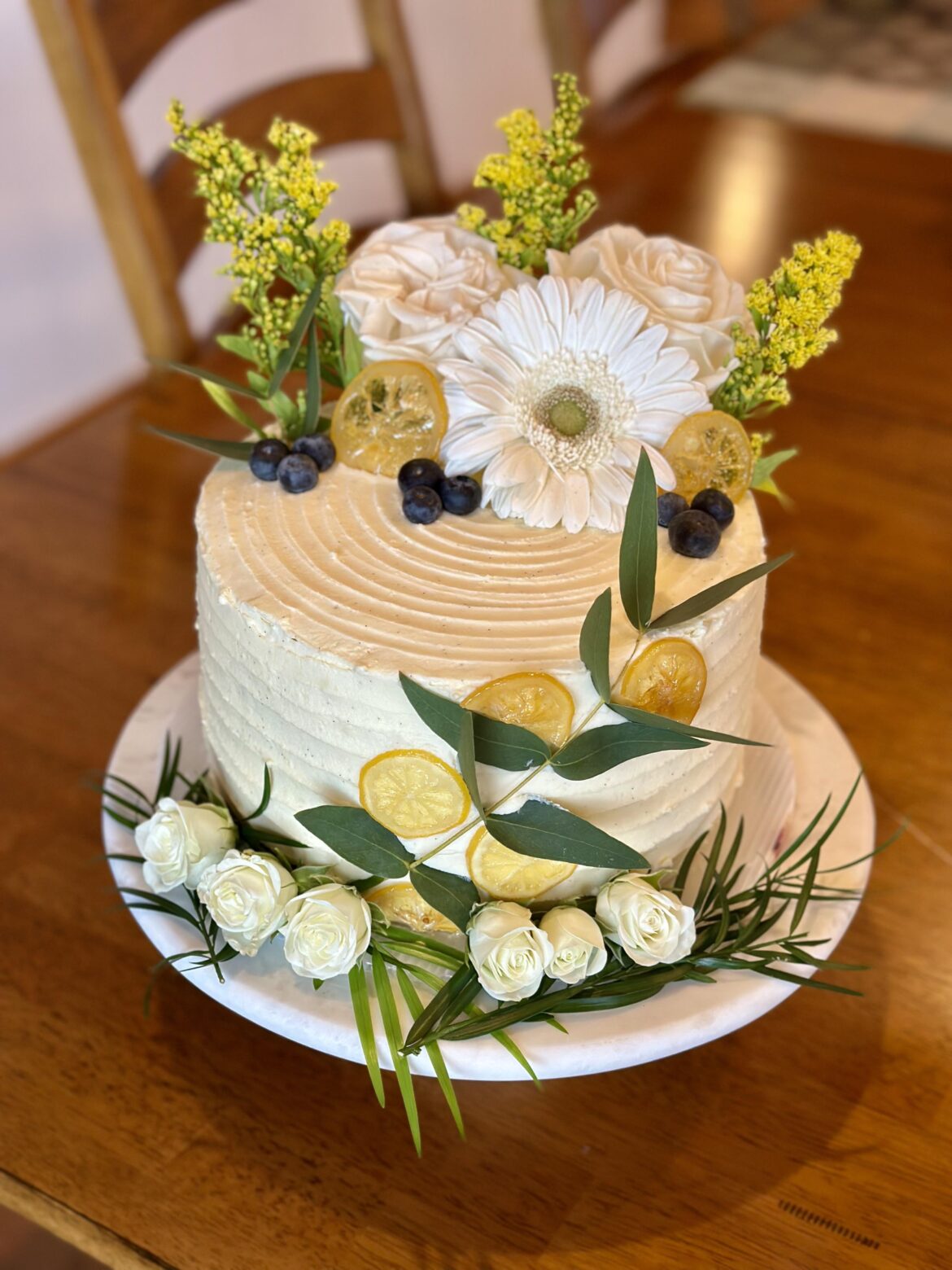 Bravetart Lemon Sunshine White Mountain Cake with lemon curd and blueberry compote filling.