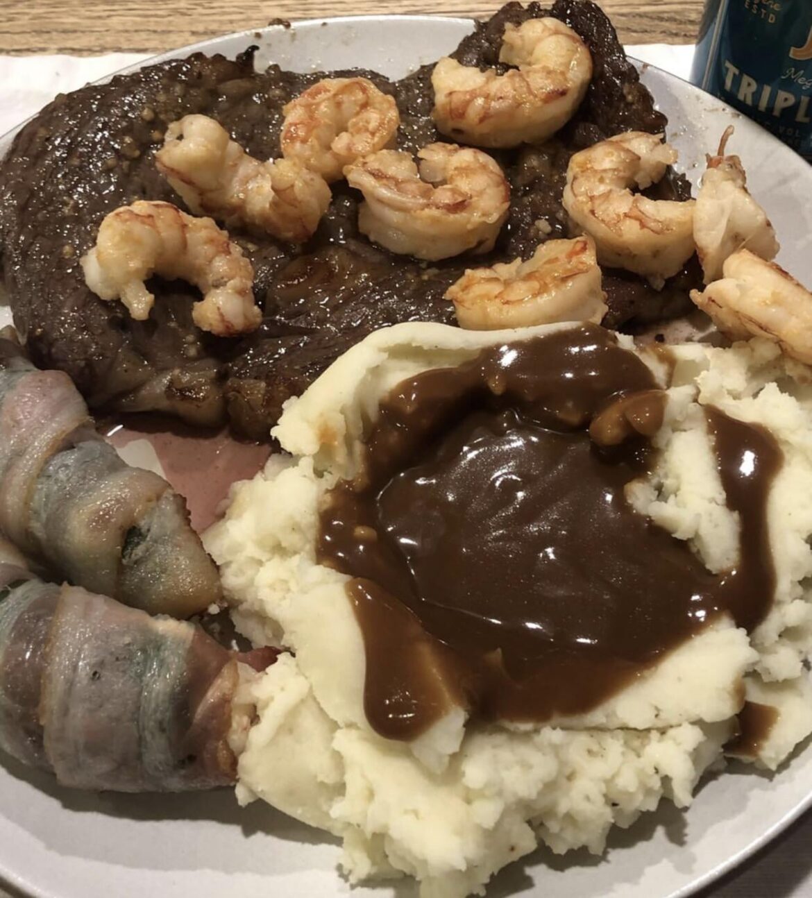 Rib eye, honey shrimp, mashed potatoes & gravy, jalapeño stuffed peppers