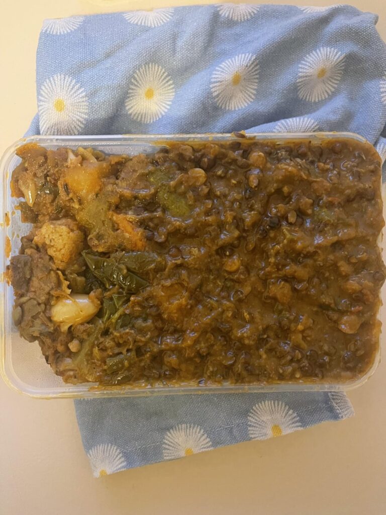 'Medium' container of Indian lentil daal with mixed vegetables  on a base of basmati rice