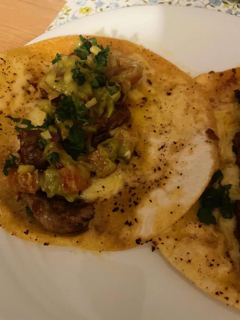 Beef tacos, cheese, guacamole and cilantro 🌮