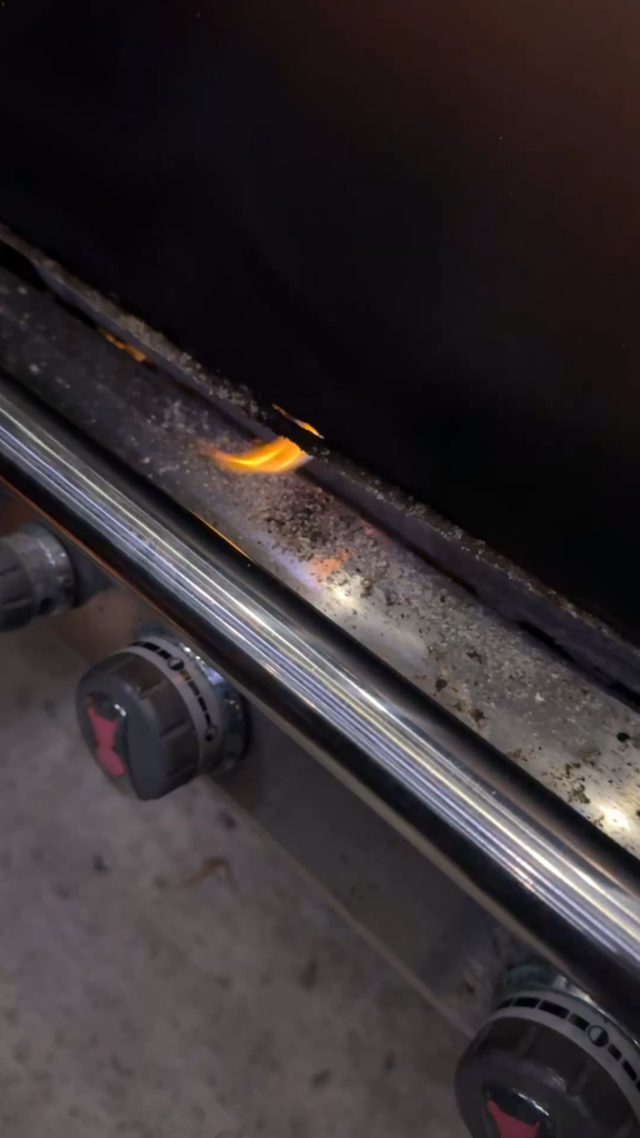 Weber Genesis body has hole burned through