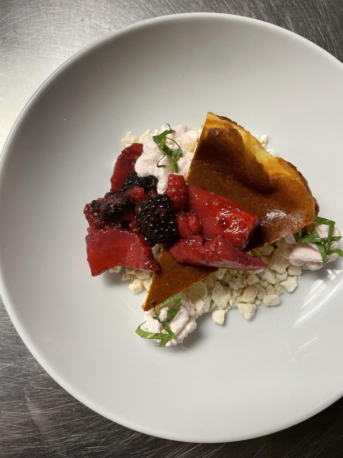 Basque Cheesecake, crushed meringue, raspberry espuma, macerated berries, mint