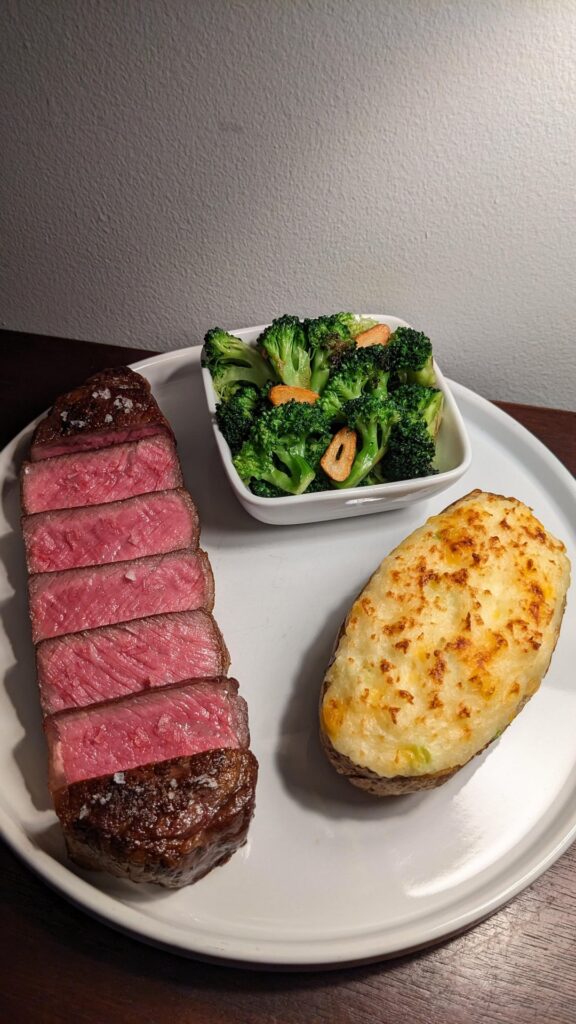 Prime Strip with Twice Baked Potato and Roasted Broccoli