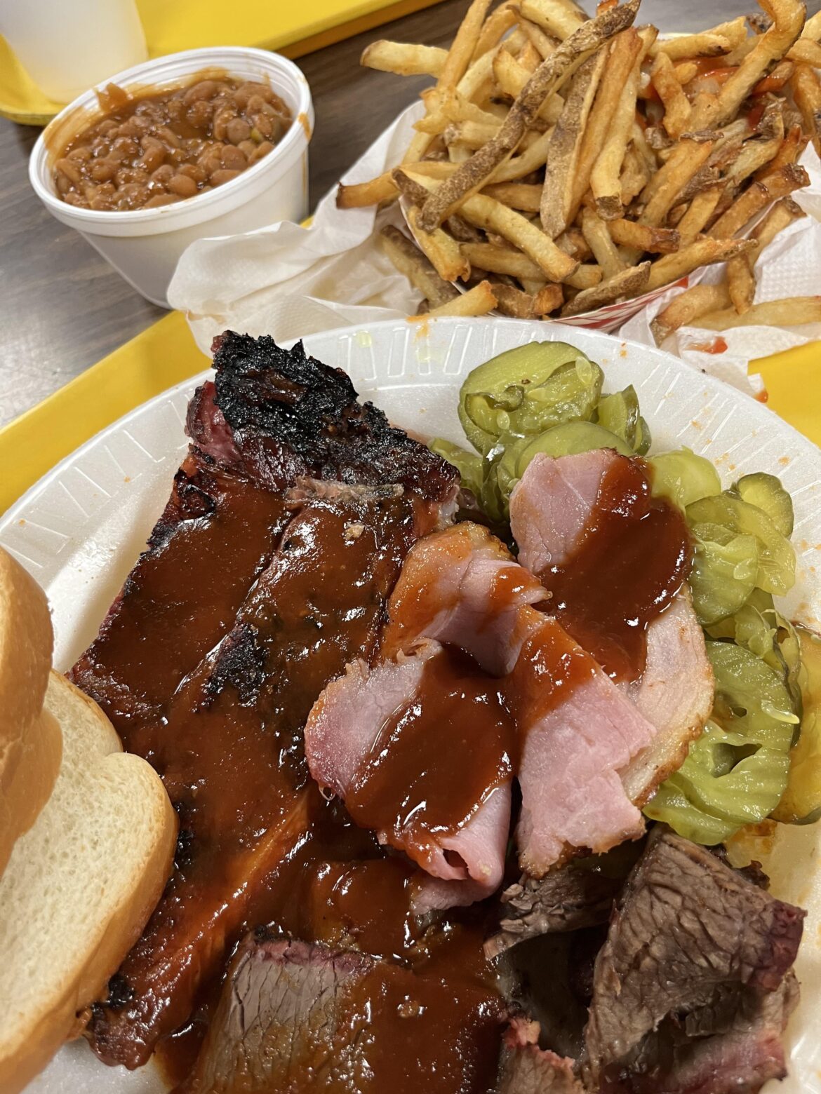 Mixed plate of ribs, ham and brisket with fries and beans. Local KC area spot, only $17.