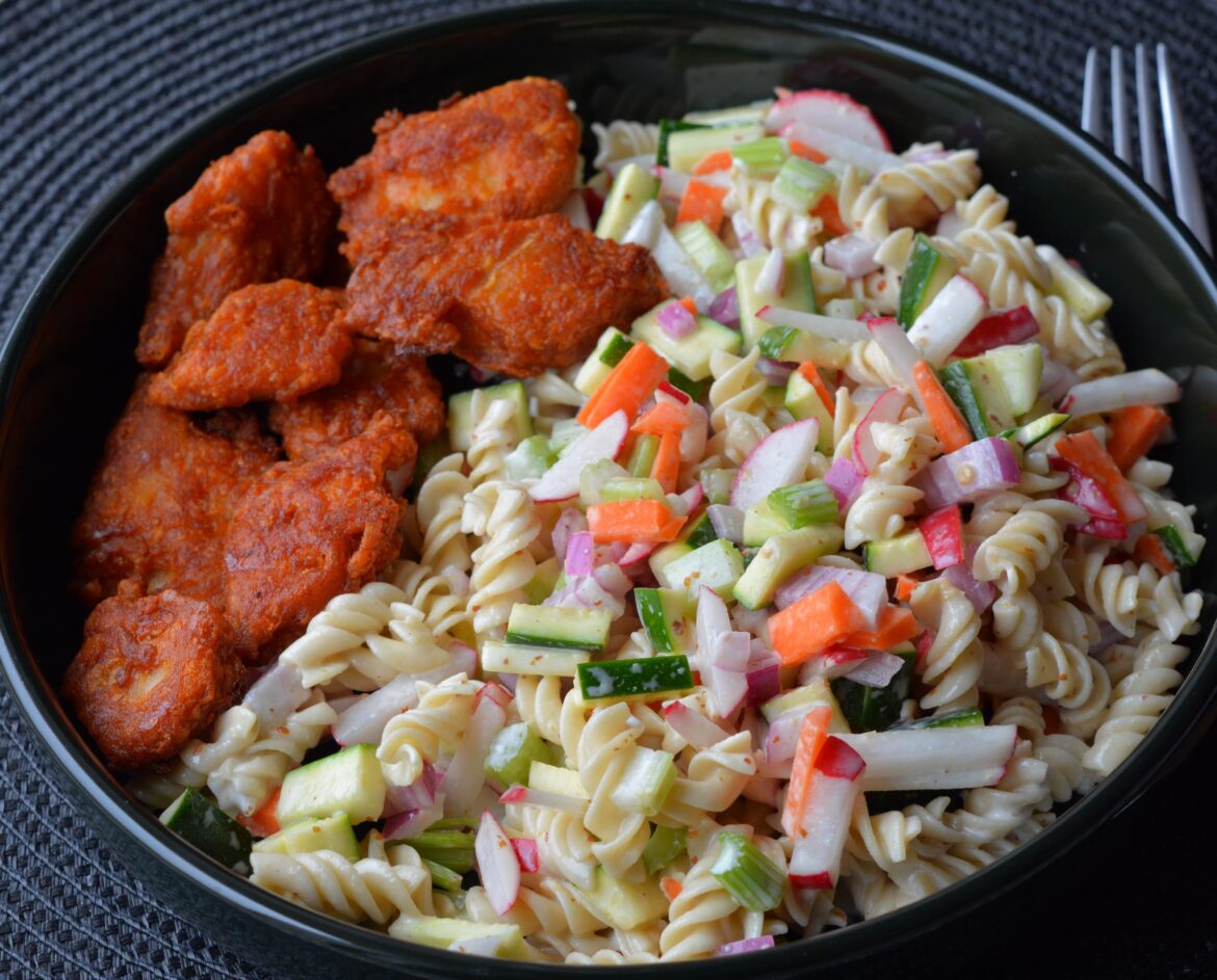 386 cal, 30 g protein. Daring plant-based buffalo chicken  wings and cold pasta salad with creamy Dijon dressing