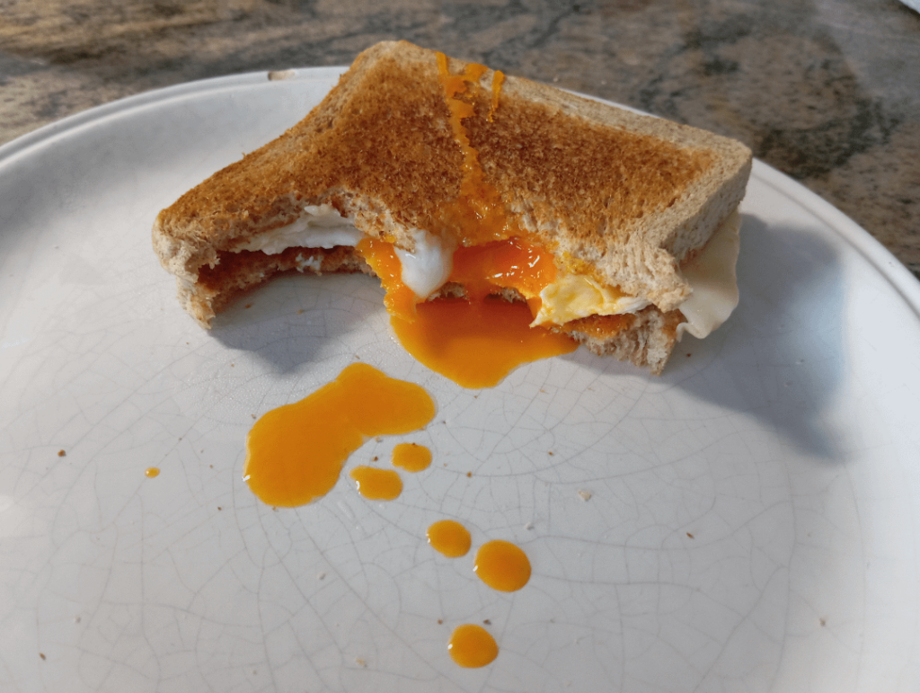 Gooey egg and cheese sandwich for breakfast. Sorry for taking a few bites, it was delicious!